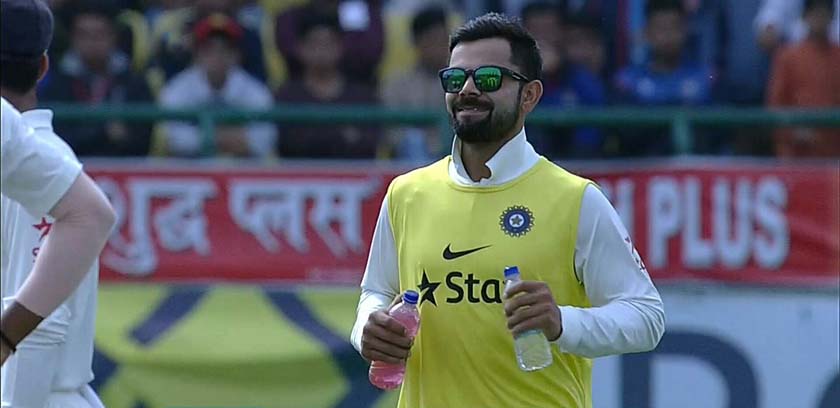 Indian player Virat Kohli bringing energy drinks for his teammates 