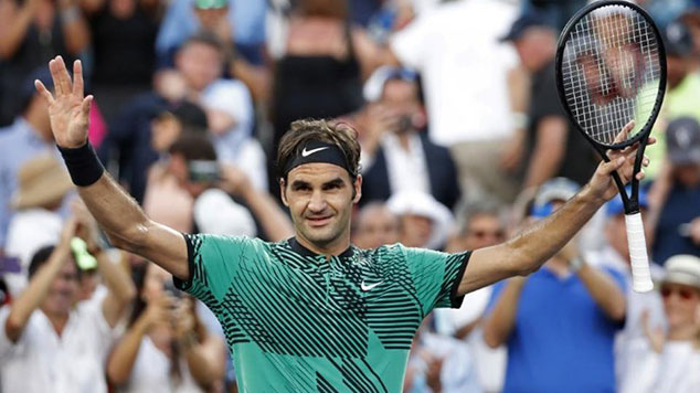 Roger Federer celebrates after his match against Roberto Bautista Agut at the Miami Open