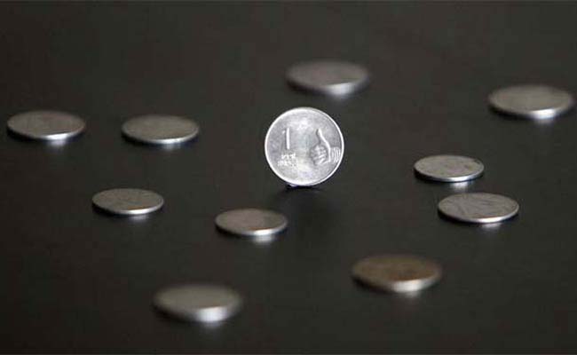 Rupee gains by 8 paise 