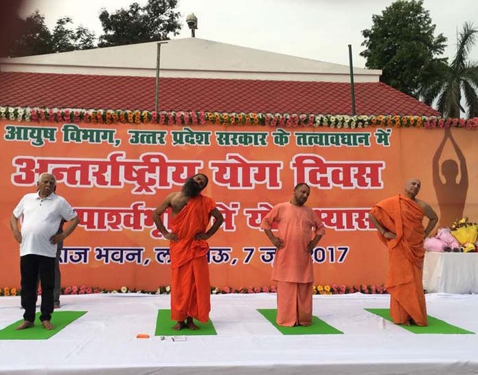 Uttar Pradesh Chief Minister Yogi Adityanath, Governor Ram Naik and Baba Ramdev performing yoga 