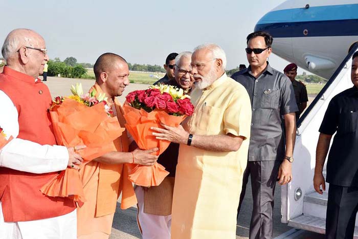 Prime Minister Narendra Modi  getting warm welcome by UP CM Yogi Adiyanath and Governor Ram Naik 