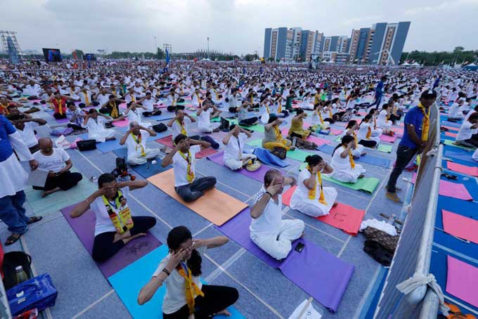 People performing yoga in Gujarat