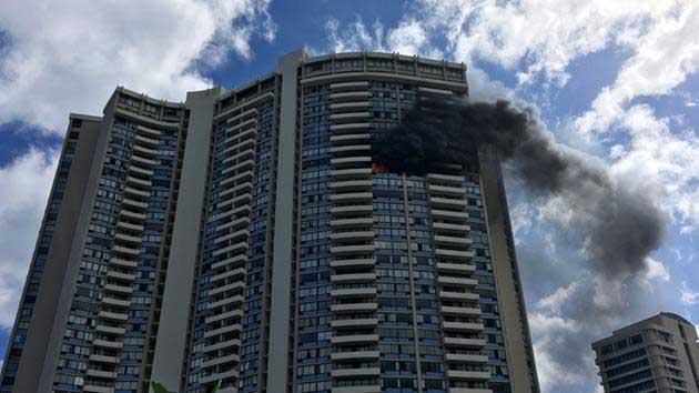 Smoke billows from a high-rise apartment building in Honolulu