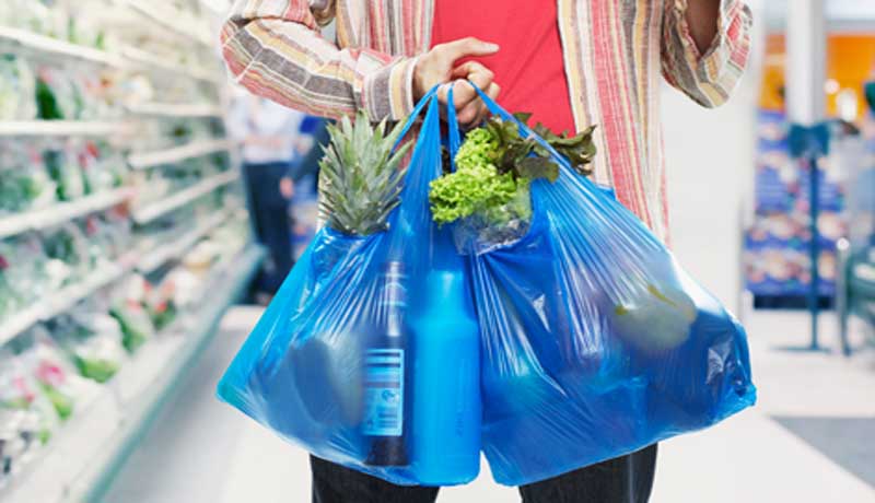 A view of man holding polythene bags (File Photo)