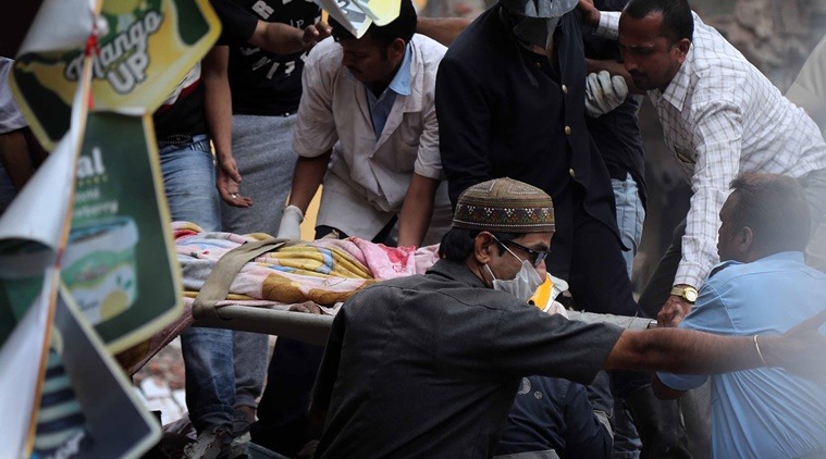 A dead body getting carried into ambulance at spot