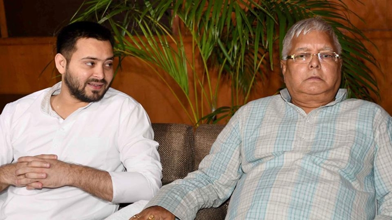 RJD leader Lalu Prasad Yadav and his son Tejashwi Yadav