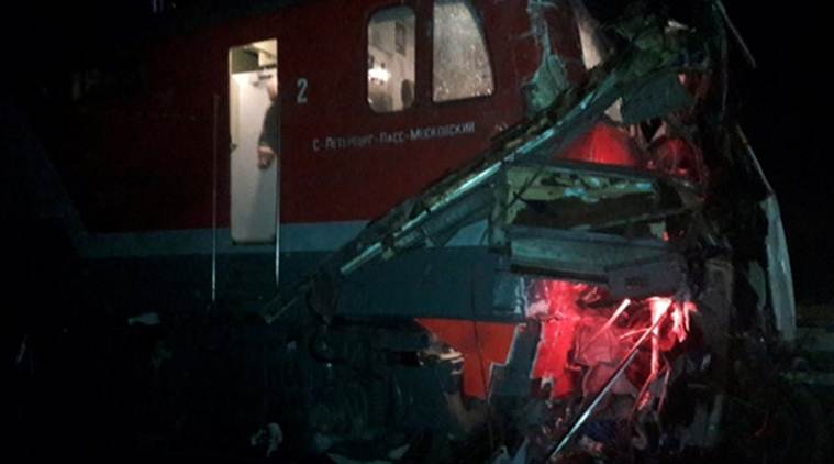 The wreckage of a train is seen after it hit a passenger bus at a crossing near the town of Pokrov