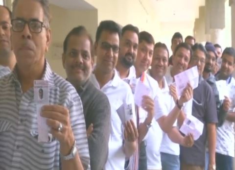 Queue outside a polling booth in Surat's  Choryasi 