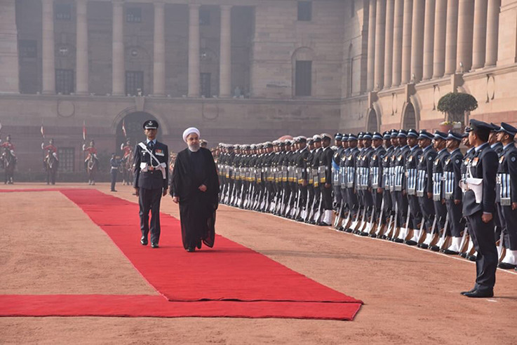 Iran President Hassan Rouhani inspects a guard of honour at the Rashtrapati Bhawan