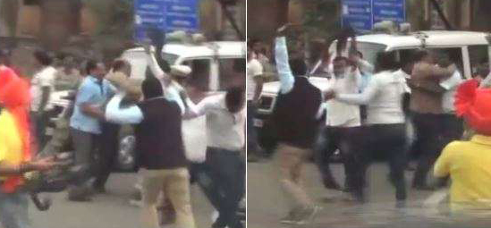 Maharashtra Youth Congress workers waving black flags.