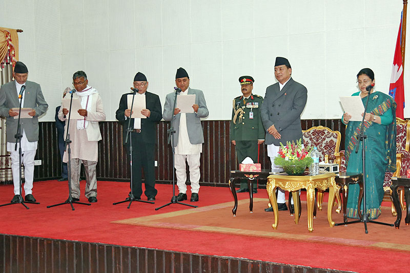 President Bidya Devi Bhandari administers the oath of office and secrecy to newly appointed ministers at Sheetal Niwas