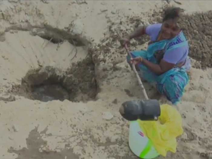 Locals dig up sandy terrain