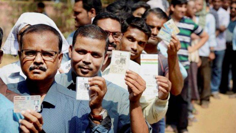 Voters standing in queue 