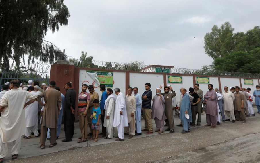 People Standing in queue to cast their vote