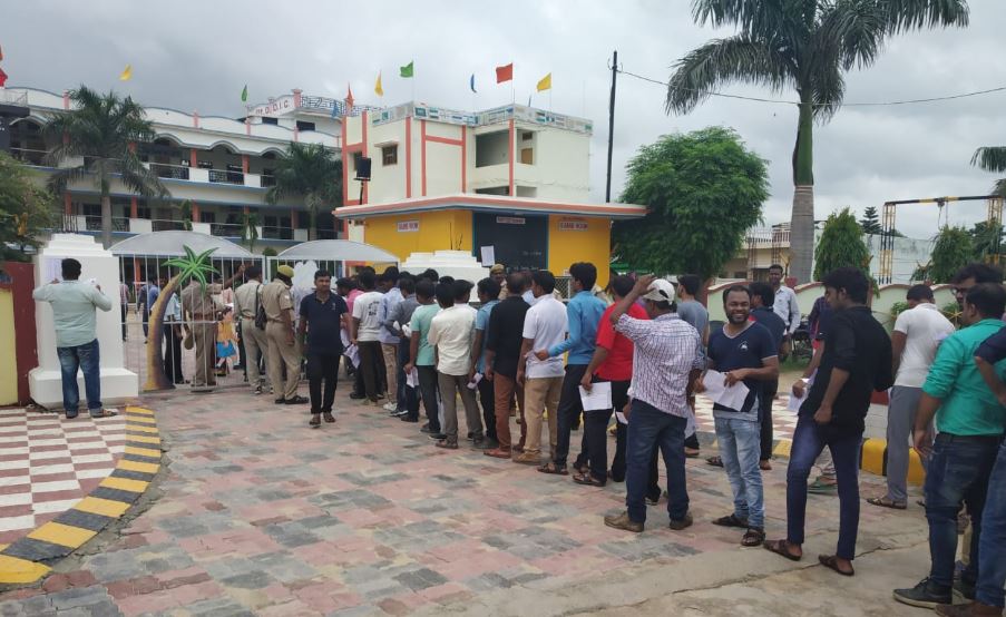 People Standing to enter the examination center