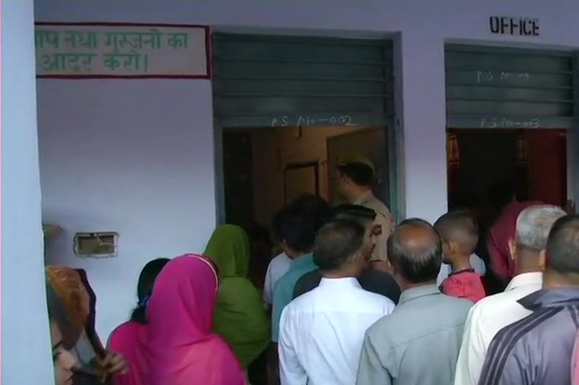 Voter standing in queue