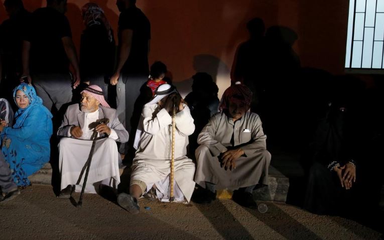 Relatives of the victim sitting outside the hospital