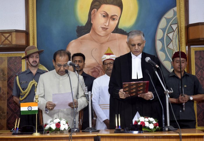 Assam governor Jagdish Mukhi administering the oath  to Justice Bopanna, as new chief justice of Gauhati High court, at Raj Bhavan, Guwahati