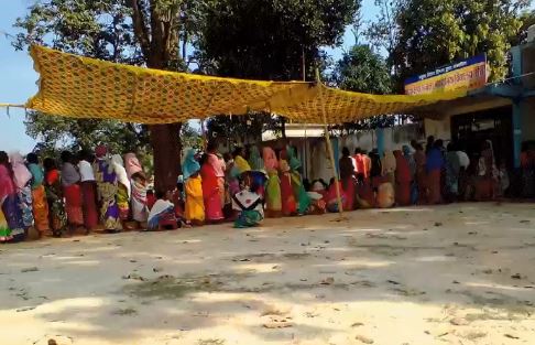 Voter stand in queue for casting their vote