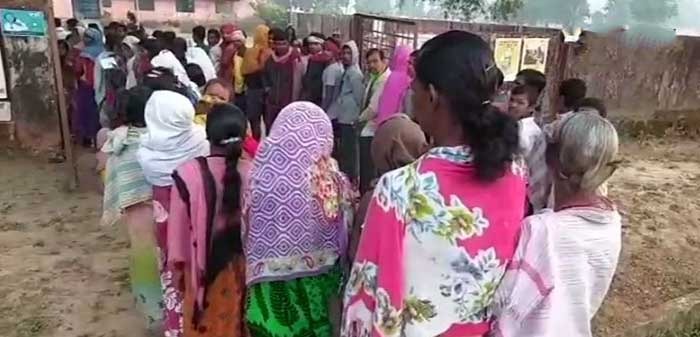 People Standing in queue to cast their vote