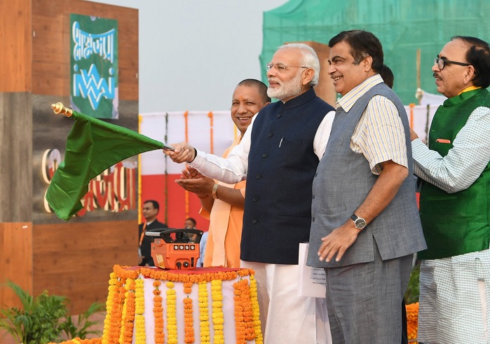 Prime Minister Narendra Modi with Union Minister Nitin Gadkari and UP CM Yogi Adityanath