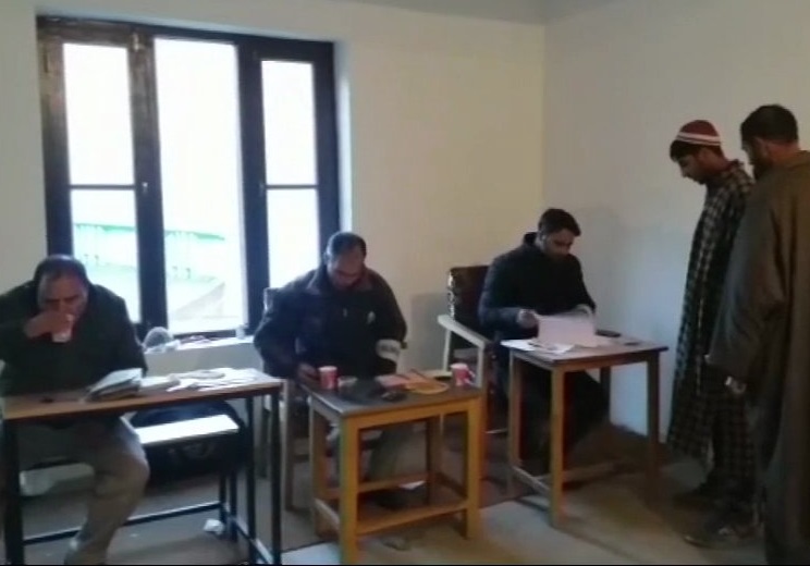 People standing in queue for casting their votes