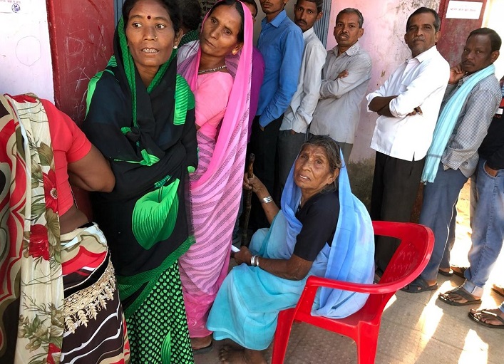 People standing in queue for casting their votes