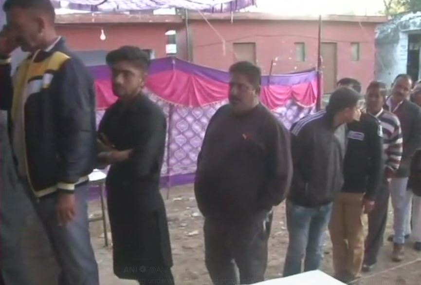 People Standing in queue to cast their vote