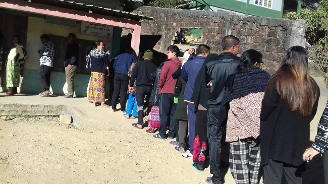 People Standing in queue to cast their vote