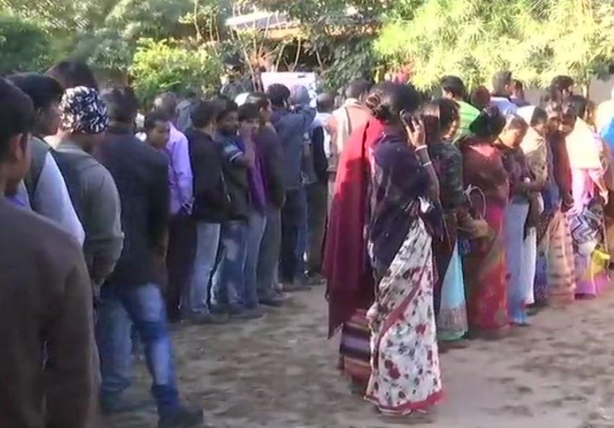 People Standing in queue to cast their vote