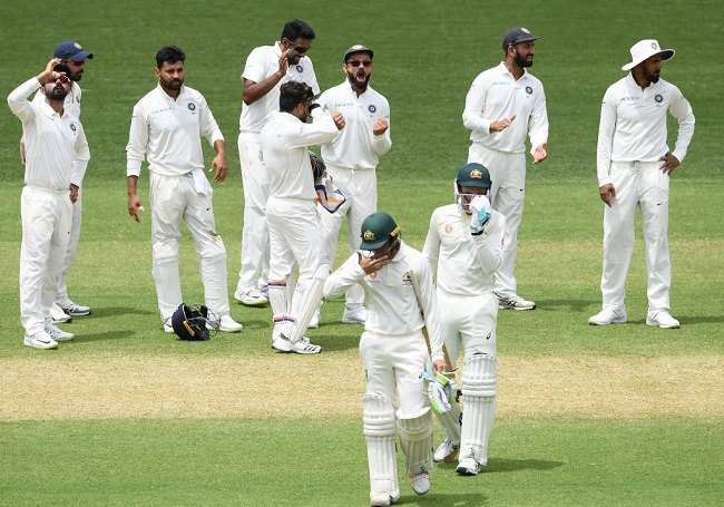 Indian team rejoicing over a wicket taken