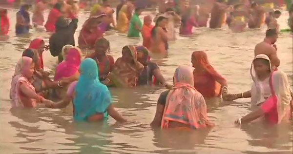 Devotees taking a holy dip at Ganga Sagar on the occasion of MakarSankranti in Prayagraj on Monday.