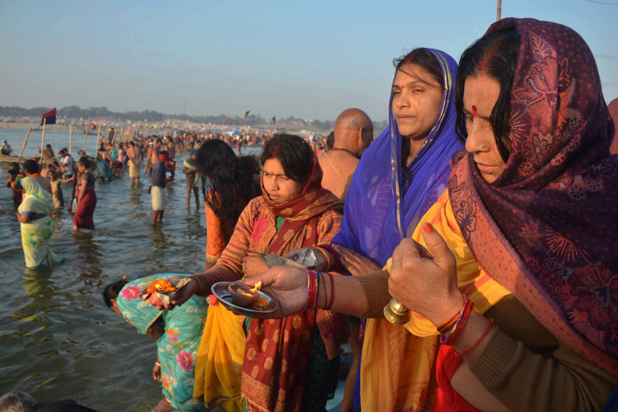 Hindu devotees offer prayers after taking holy dip at Sangam, the confluence of River Ganga, Yamuna and mythological Saraswati, on the occasion of Maghi Purnima