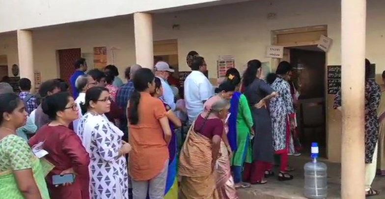 Voters line up outside polling booths