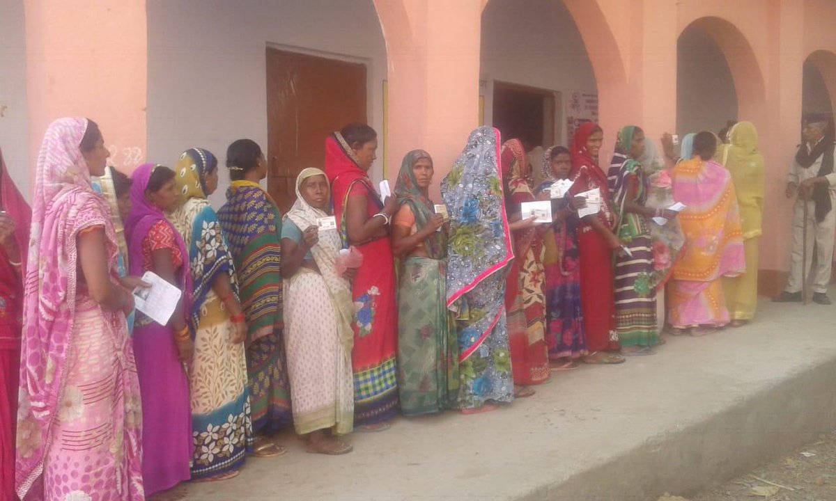 People Standing in queue to cast their vote