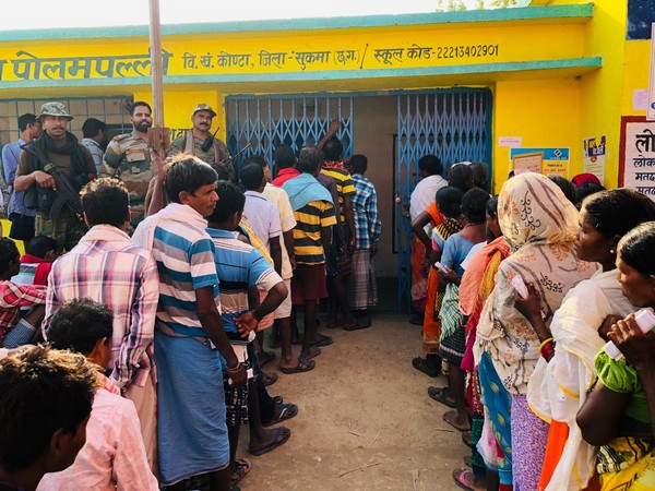 People Standing in queue to cast their vote