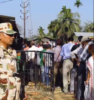 Voters line up outside polling booths