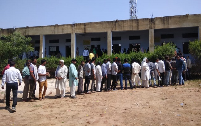 People standing in queue in Mathura