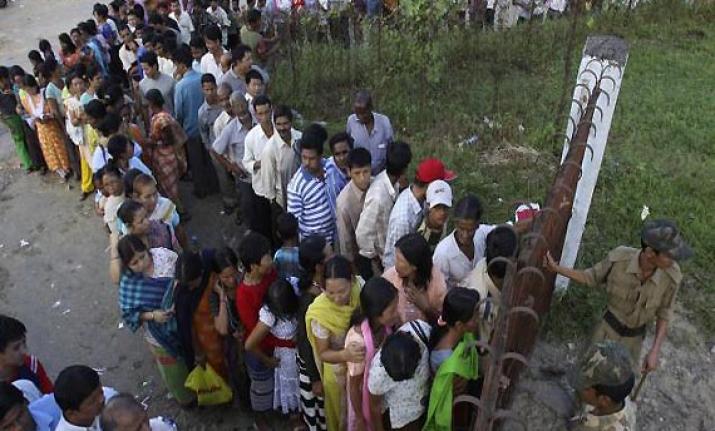 People Standing in queue to cast their vote