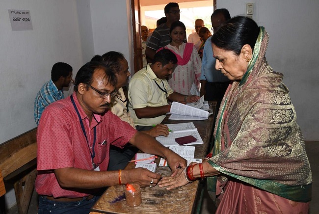 People standing in queue to cast vote