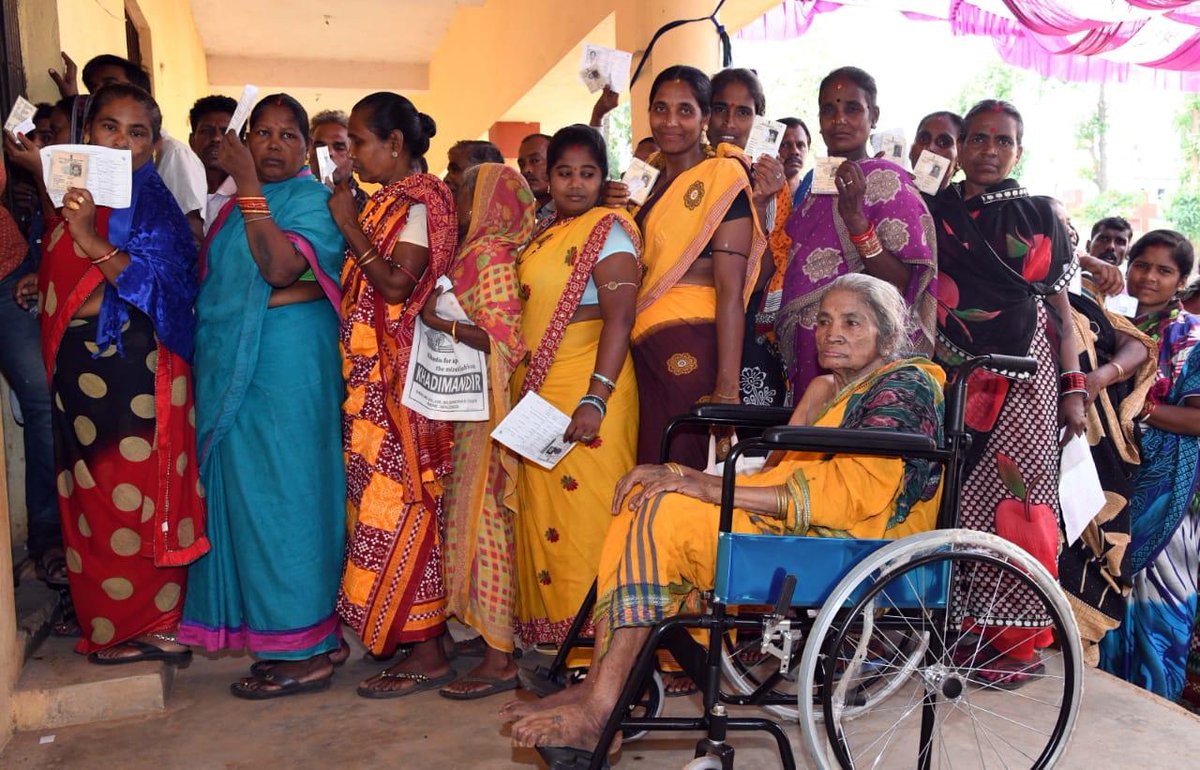 People Standing in queue to cast their vote