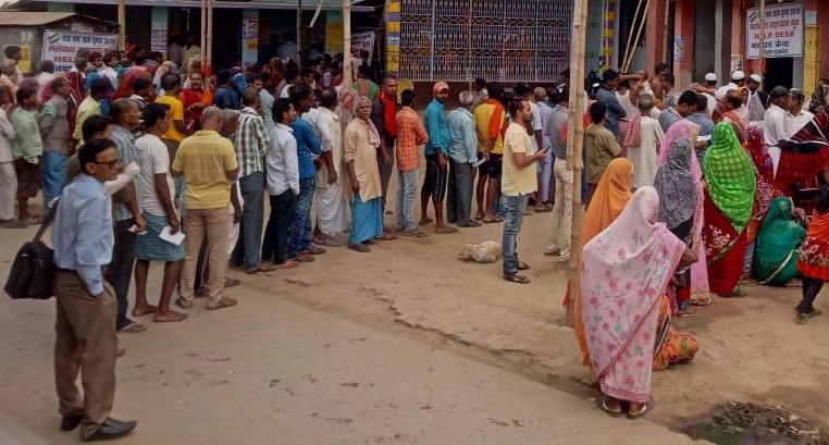 People Standing in queue to cast their vote