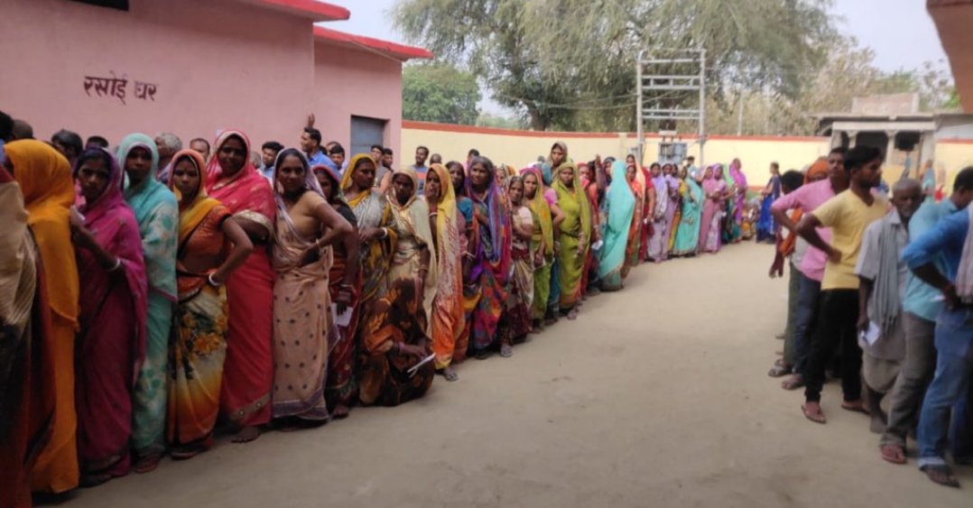 People standing in queue in Anantnag district