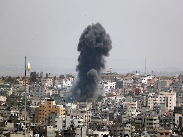 Smoke rises from a building in Gaza after Israeli airstrikes