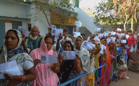 Voters line up outside polling booths