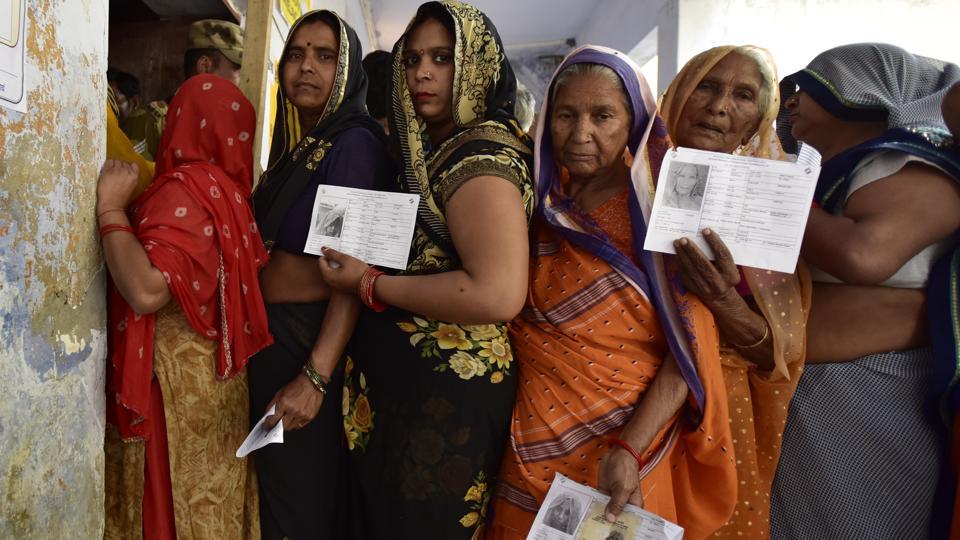 People standing in queue to cast vote