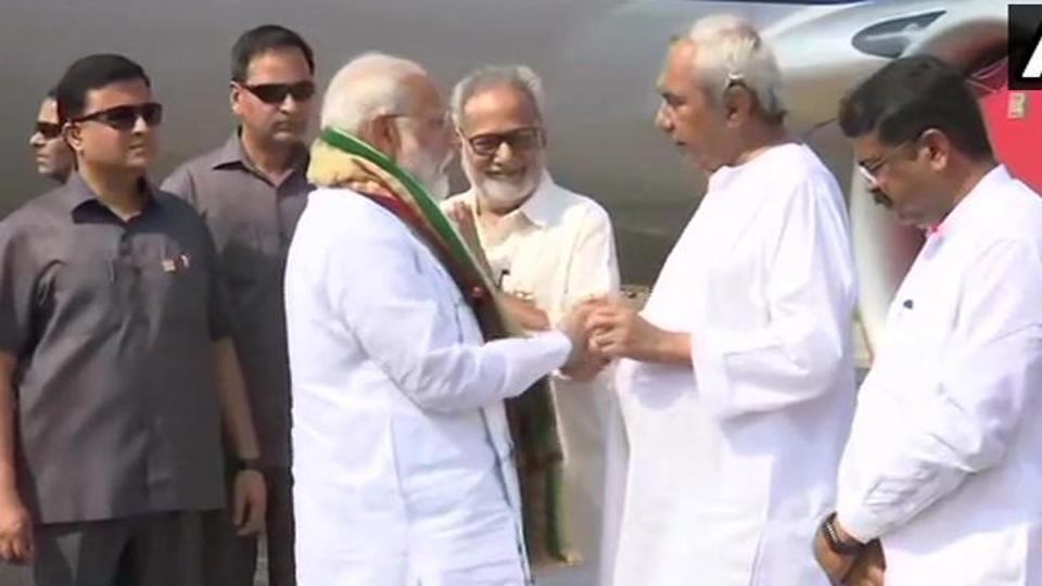 PM Narendra Modi (L) with Odisha CM Naveen Patnaik (R) at Bhubaneswar airport on Monday