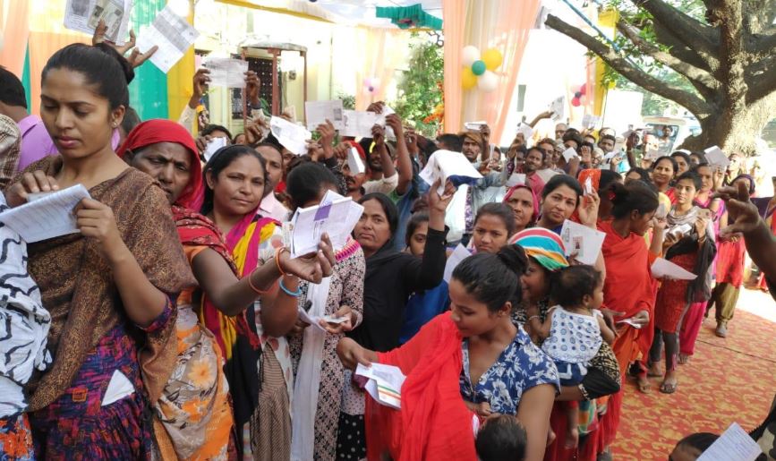 People standing in queue to cast vote