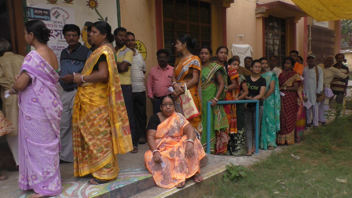 People Standing in queue to cast their vote