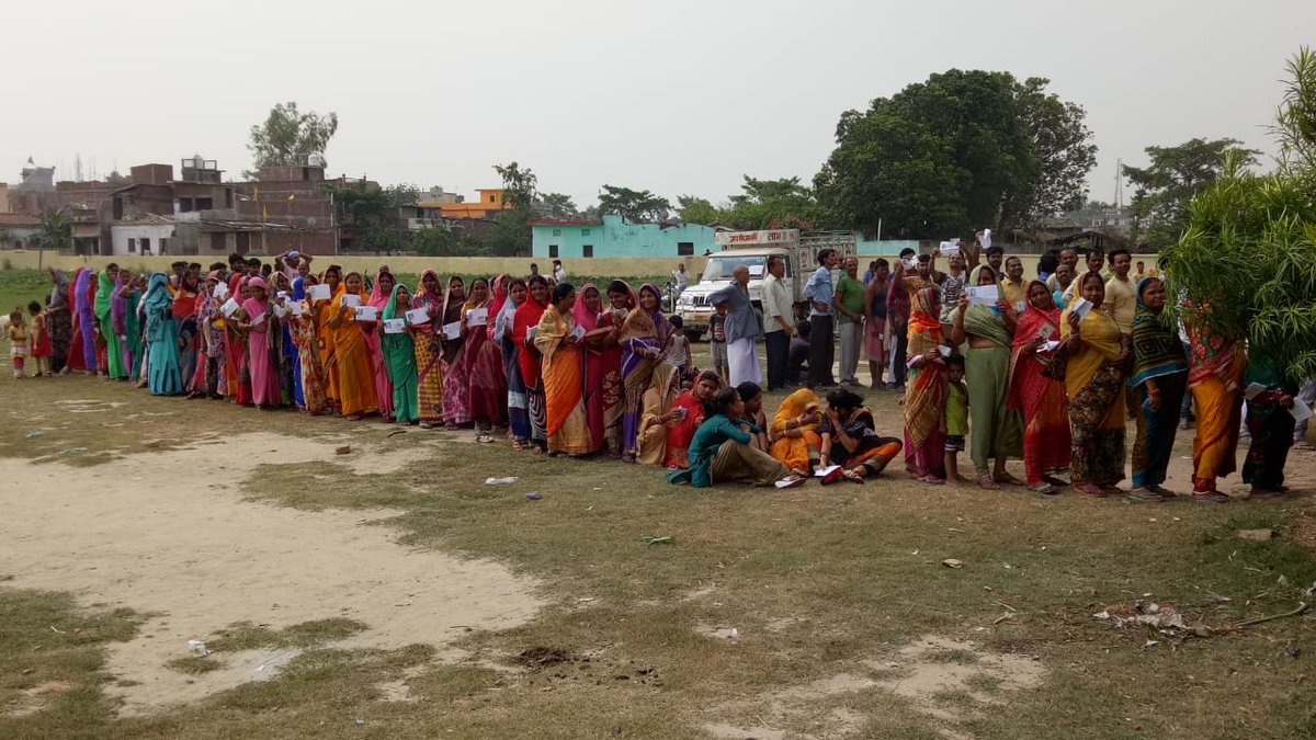 People Standing in queue to cast their vote